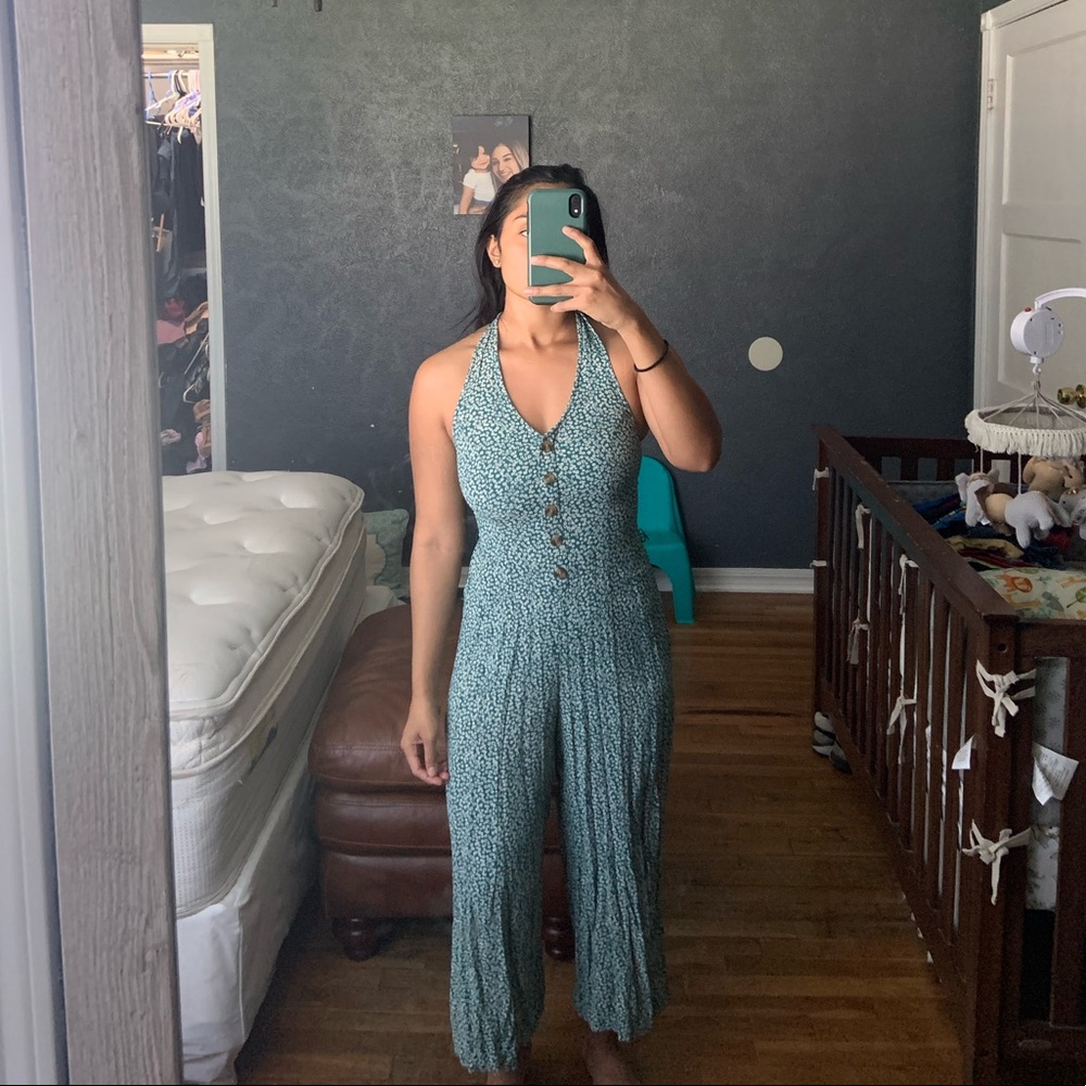 Halter bodysuit with flare boot cut legs.